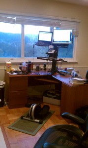 Old Desk with elliptical and sit/stand ergotron